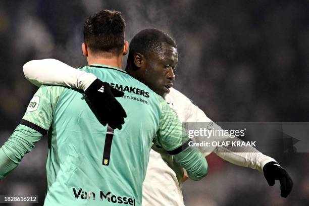 Waalwijk's Dutch goalkeeper Etienne Vaessen reacts with Ajax' Dutch forward Brian Brobbey after the Dutch Eredivisie football match between RKC...