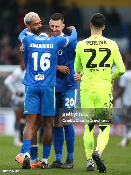Bailey Clements, Solomon Nwabuokei and Paul McCallum of Eastleigh celebrate the teams victory during the Emirates FA Cup Second Round match between...