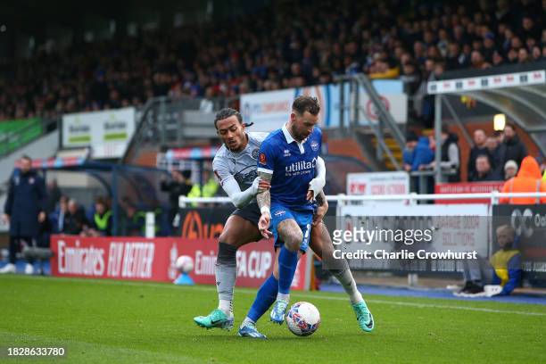 Enzio Boldewijn of Eastleigh is challenged by Femi Azeez of Reading during the Emirates FA Cup Second Round match between Eastleigh and Reading at...