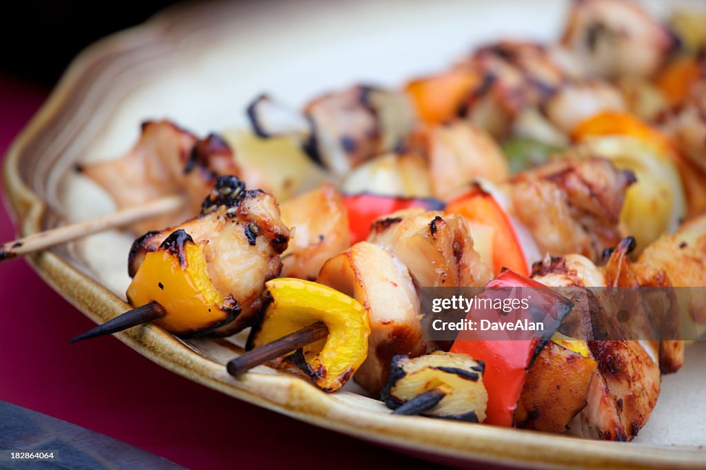 Chicken kebab satay inside of a plate