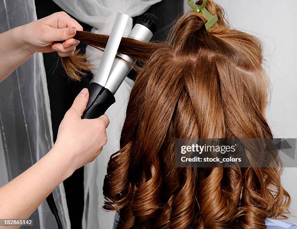 woman at hairdresser - hair curlers stock pictures, royalty-free photos & images