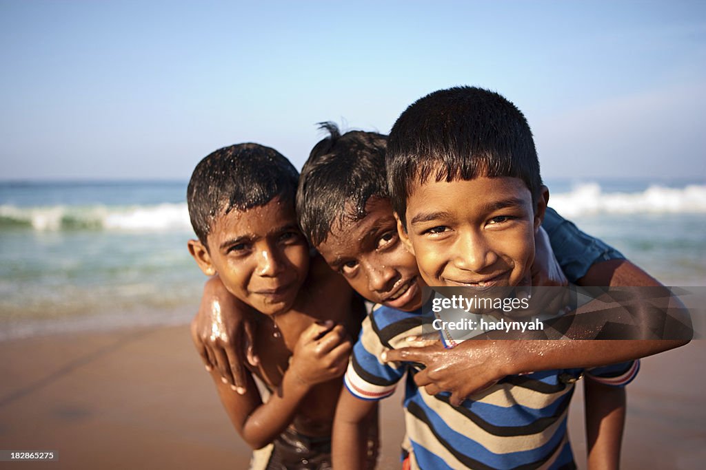 Three Indian boys on the beach