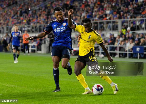 Yaw Yeboah of Columbus Crew crosses against Alvas Powell of FC Cincinnati during the 2023 MLS Cup Playoffs Eastern Conference Final match at TQL...