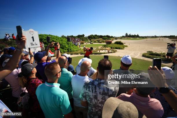 Tiger Woods of the United States plays his shot from the first tee during the final round of the Hero World Challenge at Albany Golf Course on...