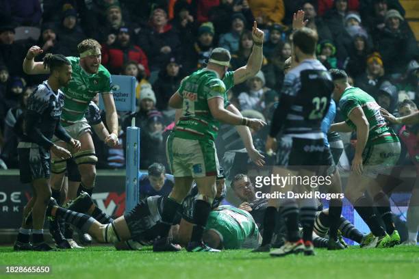 Ollie Chessum of Leicester Tigers celebrates as Tommy Reffell scores their sides fifth try during the Gallagher Premiership Rugby match between...
