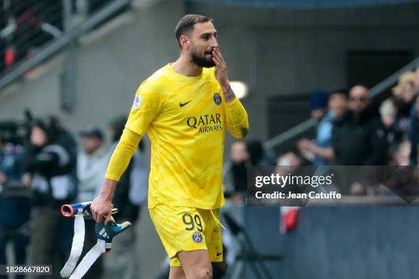 Goalkeeper Gianluigi Donnarumma leaves the pitch after receiving a red card from referee Bastien Dechepy during the Ligue 1 Uber Eats match between...