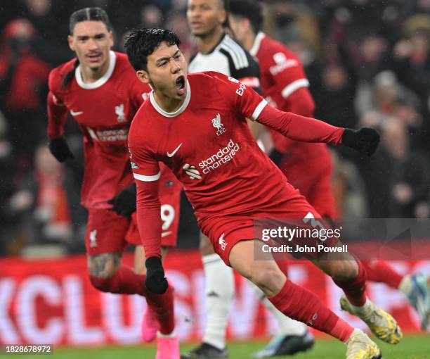 Wataru Endo of Liverpool celebrates after scoring the third Liverpool goal in the Premier League match between Liverpool FC and Fulham FC at Anfield...