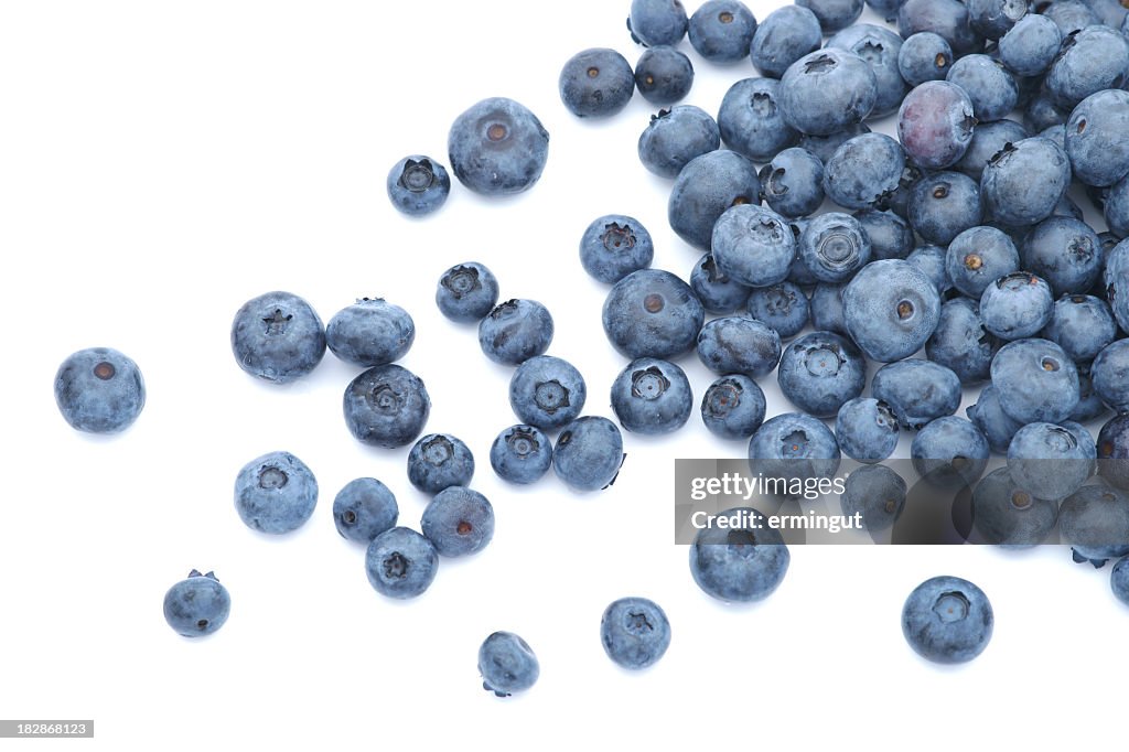 Blueberries scattered on white background