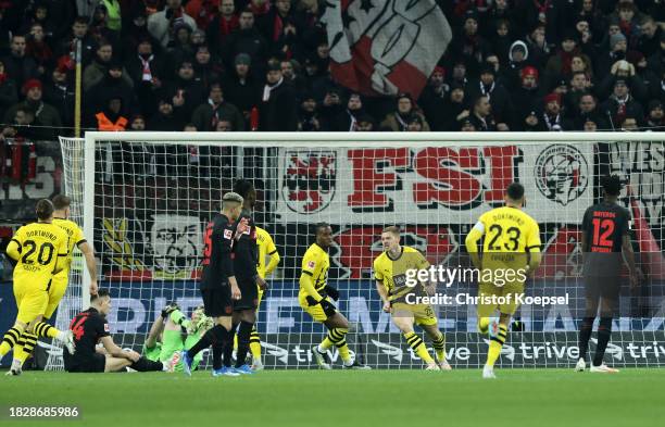 Julian Ryerson of Borussia Dortmund celebrates after scoring the team's first goal during the Bundesliga match between Bayer 04 Leverkusen and...