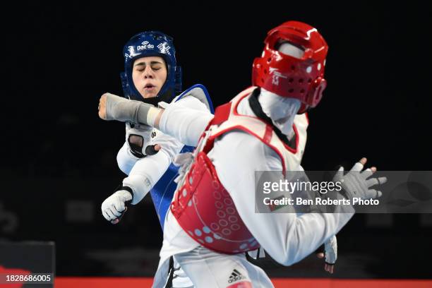 Julyana Al-Sadeq of Jordan competes in the final against Aleksandra Perisic of Serbia in the Female -67kg category at Manchester Regional Arena on...