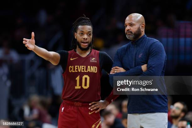 Darius Garland and head coach J.B. Bickerstaff of the Cleveland Cavaliers talk during the second half against the Portland Trail Blazers at Rocket...