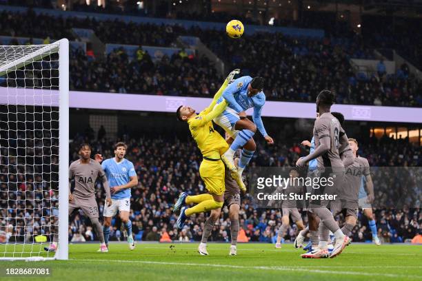 Guglielmo Vicario of Tottenham Hotspur clashes with Manuel Akanji of Manchester City during the Premier League match between Manchester City and...