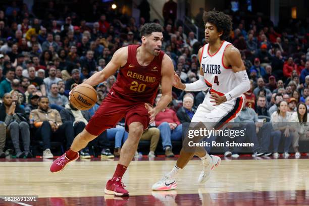 Georges Niang of the Cleveland Cavaliers drives against Matisse Thybulle of the Portland Trail Blazers during the second half at Rocket Mortgage...