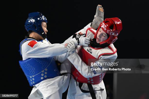 Sarah Chaari of Belgium competes in the final against Mengyu Zhang of China in the Female -67kg category at Manchester Regional Arena on December 03,...