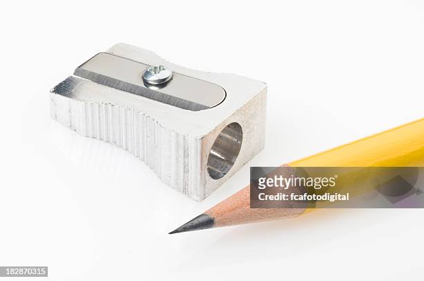 yellow pencil tip and sharpener on white background - pencil sharpener stockfoto's en -beelden