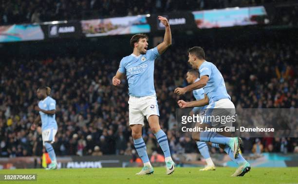 Ruben Dias of Manchester City celebrates after Son Heung-min of Tottenham Hotspur scores an own goal during the Premier League match between...