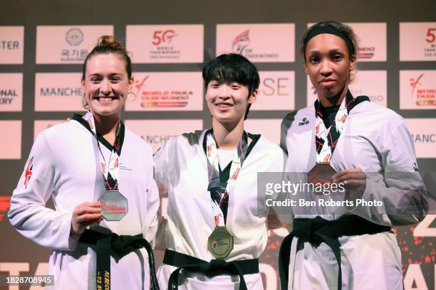 Dabin Lee of South Korea, Rebecca Mcgowan of Great Britain and Althea Laurin of France with their medals at Manchester Regional Arena on December 03,...