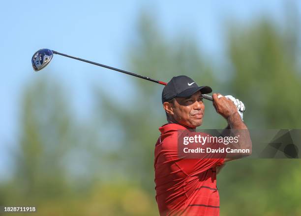 Tiger Woods of The United States plays his tee shot on teh fourth hole during the final round of the Hero World Challenge at Albany Golf Course on...