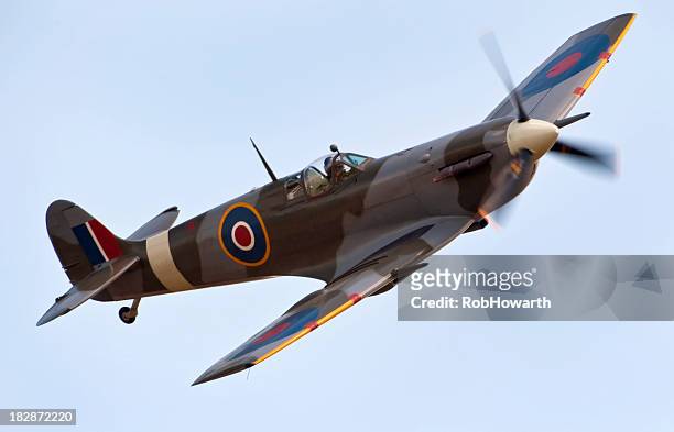 a close-up of a supermarine spitfire aircraft in flight - world war ii stock pictures, royalty-free photos & images