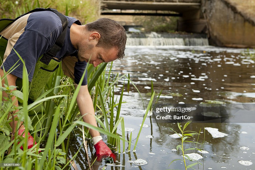 Taking samples of the soil and groundwater, environmental research.