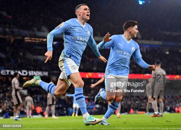 Phil Foden of Manchester City celebrates with teammate Julian Alvarez after scoring the team's second goal during the Premier League match between...