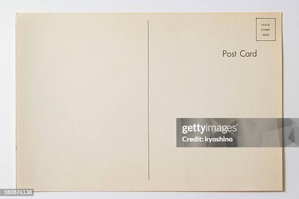 isolierte schuss von alte leere postkarte auf weißem hintergrund - postcard stock-fotos und bilder