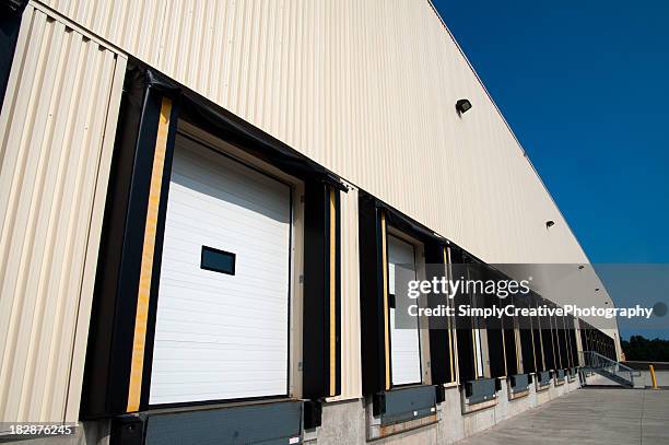 warehouse loading docks for products - industrial door stock pictures, royalty-free photos & images