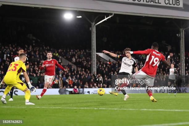 Tom Cairney of Fulham scores the fifth goal for his team during the Premier League match between Fulham FC and Nottingham Forest at Craven Cottage on...