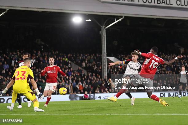 Tom Cairney of Fulham scores the fifth goal for his team during the Premier League match between Fulham FC and Nottingham Forest at Craven Cottage on...