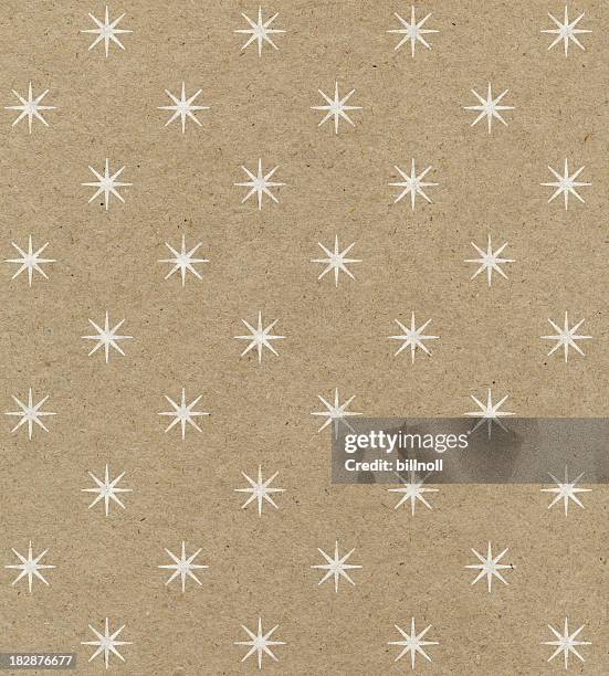 recycled paper with star pattern - wrapping stockfoto's en -beelden