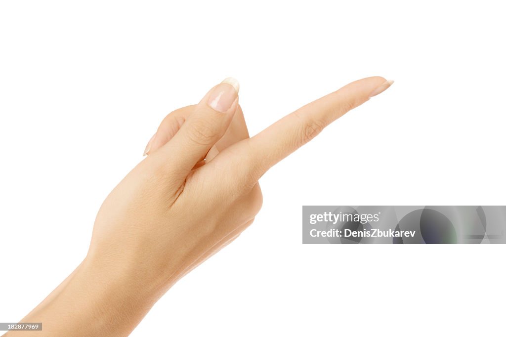 Female hand pointing upside down with index finger on white