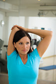 Woman Facing the Camera Doing Triceps Stretch