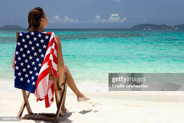 woman on vacation at the beach in american virgin islands - red white and blue beach stock pictures, royalty-free photos & images