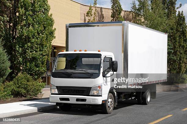 white delivery truck parked on road with trees - moving truck stock pictures, royalty-free photos & images