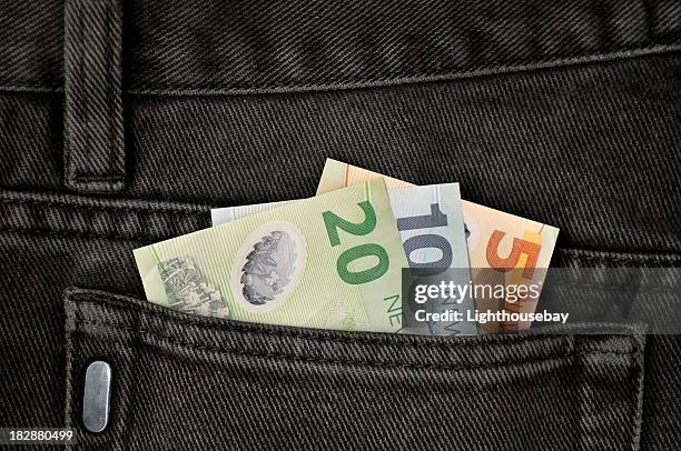 pocket money - back pocket stock pictures, royalty-free photos & images