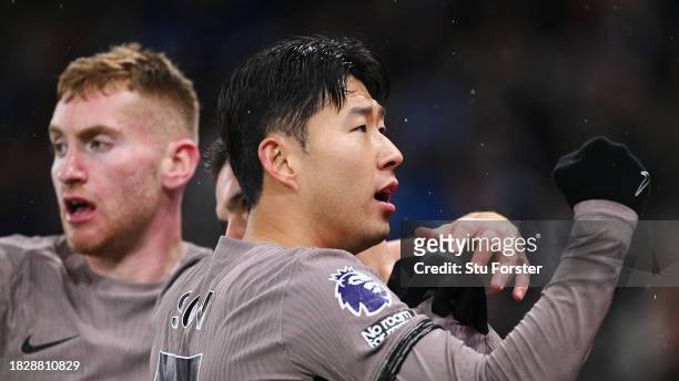Giovani Lo Celso of Tottenham Hotspur celebrates with teammate Son Heung-Min after scoring the team's second goal during the Premier League match...