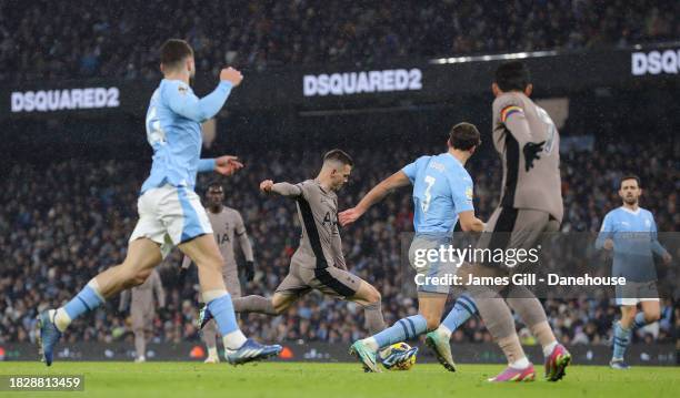 Giovani Lo Celso of Tottenham Hotspur scores their second goal during the Premier League match between Manchester City and Tottenham Hotspur at...