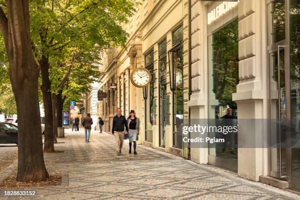 people walk the old historic streets of old town in prague czech republic czechia - stare mesto stock pictures, royalty-free photos & images