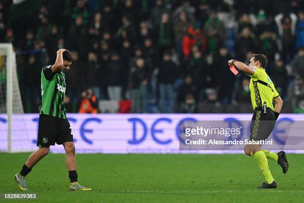 Referee Matteo Marcenaro shows a red card to Daniel Boloca of US Sassuolo during the Serie A TIM match between US Sassuolo and AS Roma at Mapei...