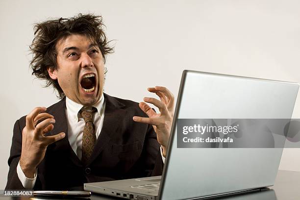 crazy businessman frustrated with his computer - angery stock pictures, royalty-free photos & images