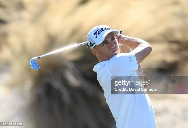 Justin Thomas of The United States plays his second shot on the third hole during the final round of the Hero World Challenge at Albany Golf Course...