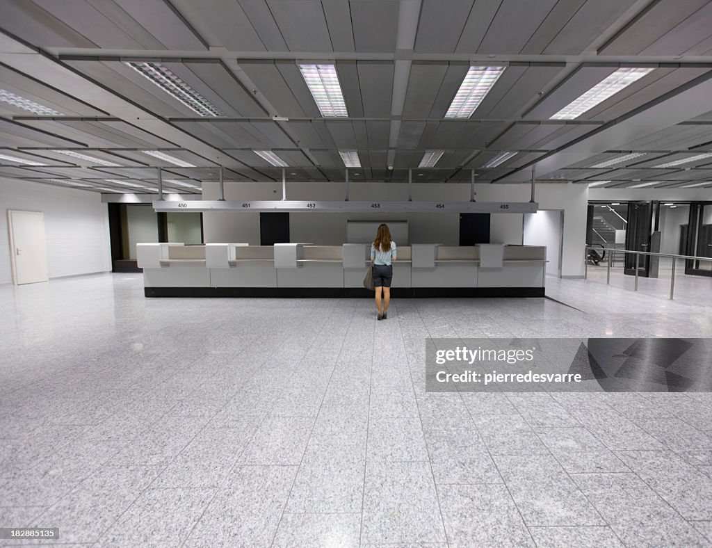 Lone customer in a large empty terminal