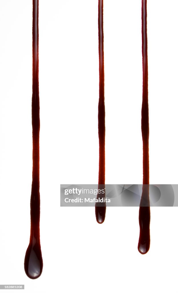 Three dark blood drops against a white background