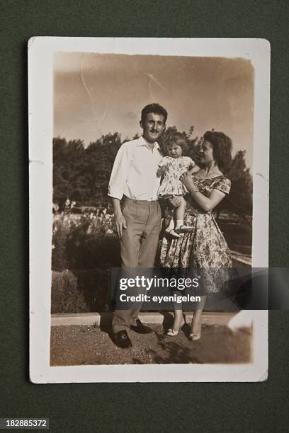 old picture of family posing together - vintage photograph stock pictures, royalty-free photos & images