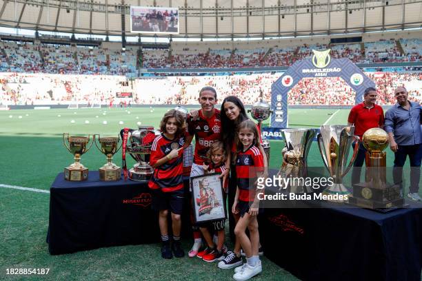 Filipe Luis of Flamengo poses with trophies and his family prior to the match between Flamengo and Cuiaba as part of Brasileirao 2023 at Maracana...