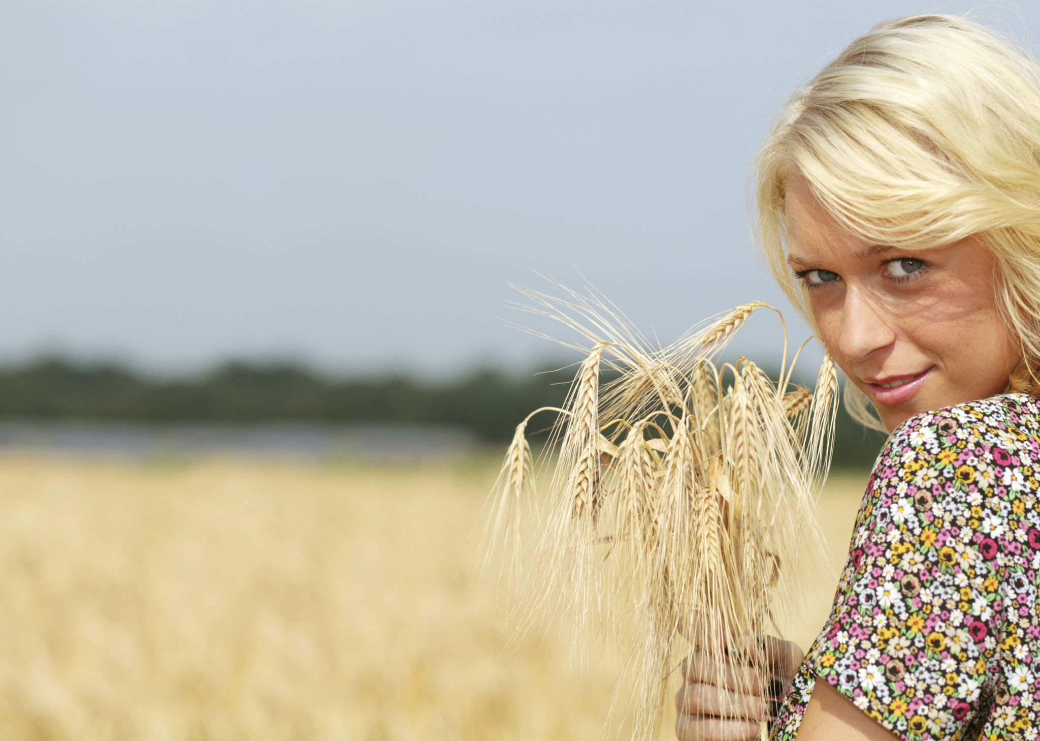 blond female holding grain with copyspace blond female holding grain with copyspace