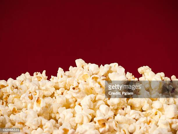 pile of theater popcorn - popcorn bildbanksfoton och bilder