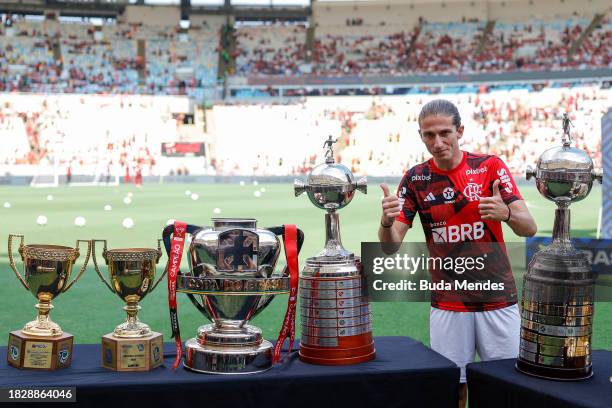 Filipe Luis of Flamengo poses with trophies prior to the match between Flamengo and Cuiaba as part of Brasileirao 2023 at Maracana Stadium on...