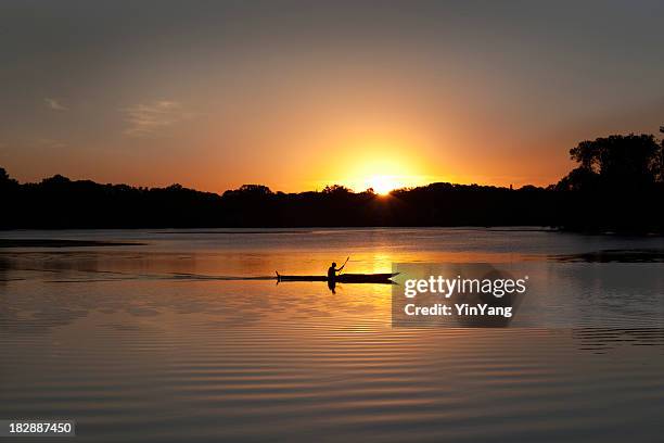 sunset kayaking in lake of the isles, minneapolis, minnesota - minnesota lake stock pictures, royalty-free photos & images