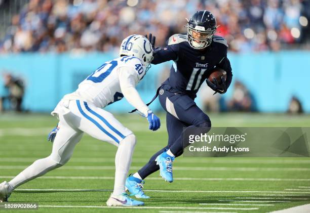 Chris Moore of the Tennessee Titans carries the ball against the Indianapolis Colts during the first half at Nissan Stadium on December 03, 2023 in...